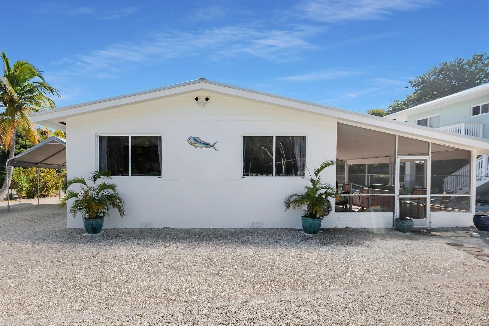 20 Palm Drive Key Largo, FL 33037 - Photo 26 of 47 a view of a chair and table in the backyard