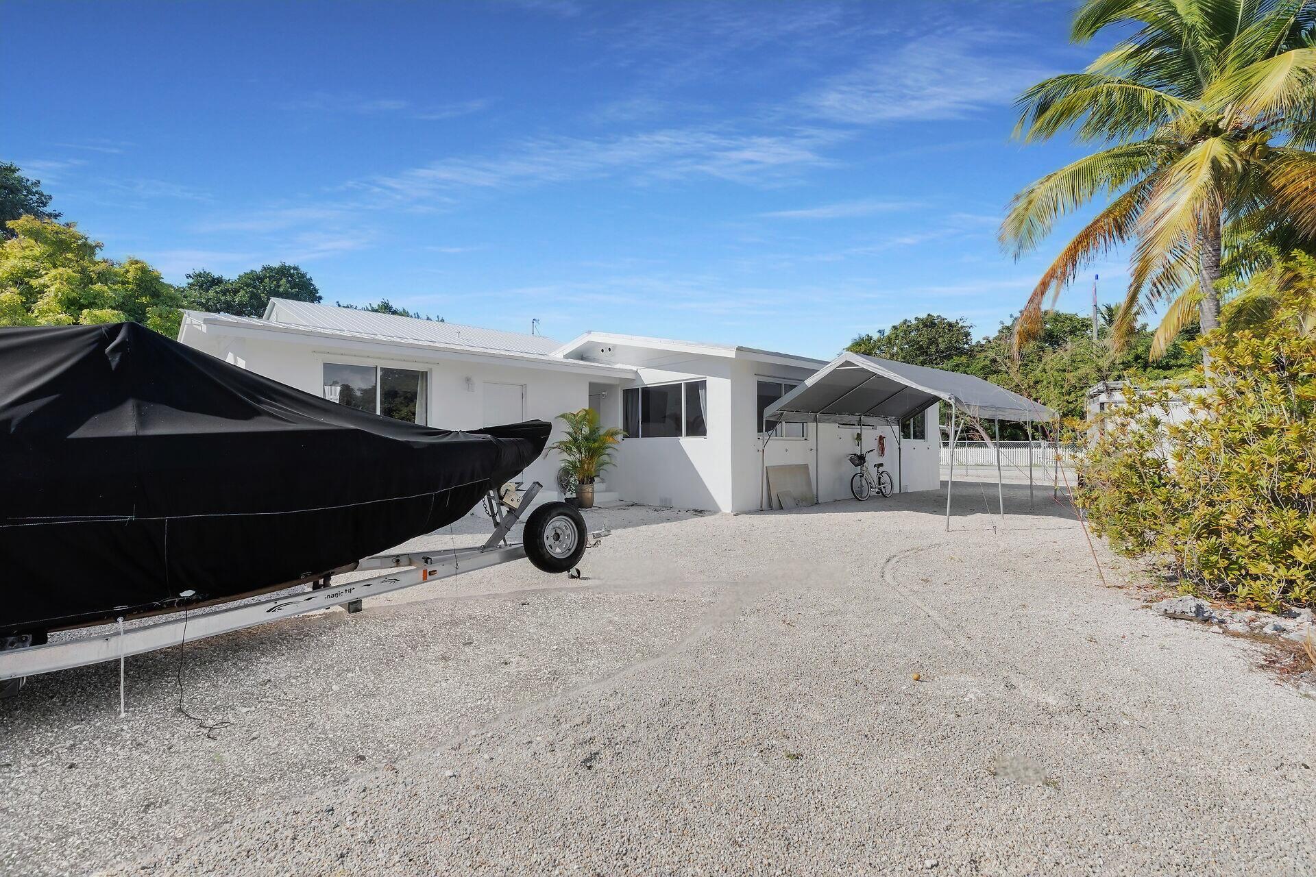 20 Palm Drive Key Largo, FL 33037 - Photo 31 of 47 a view of a house with a yard