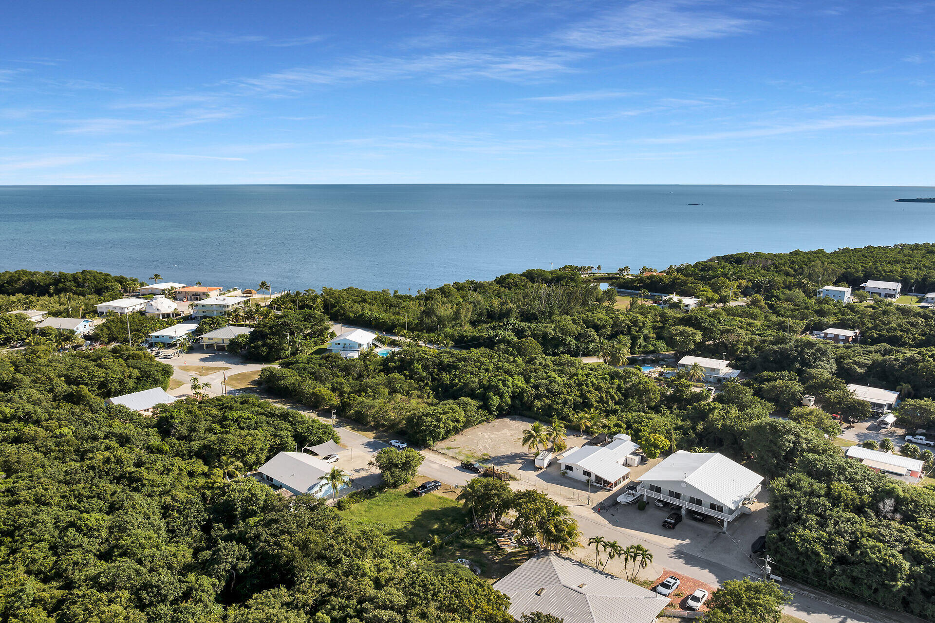 20 Palm Drive Key Largo, FL 33037 - Photo 45 of 47 an aerial view of a houses with a lake