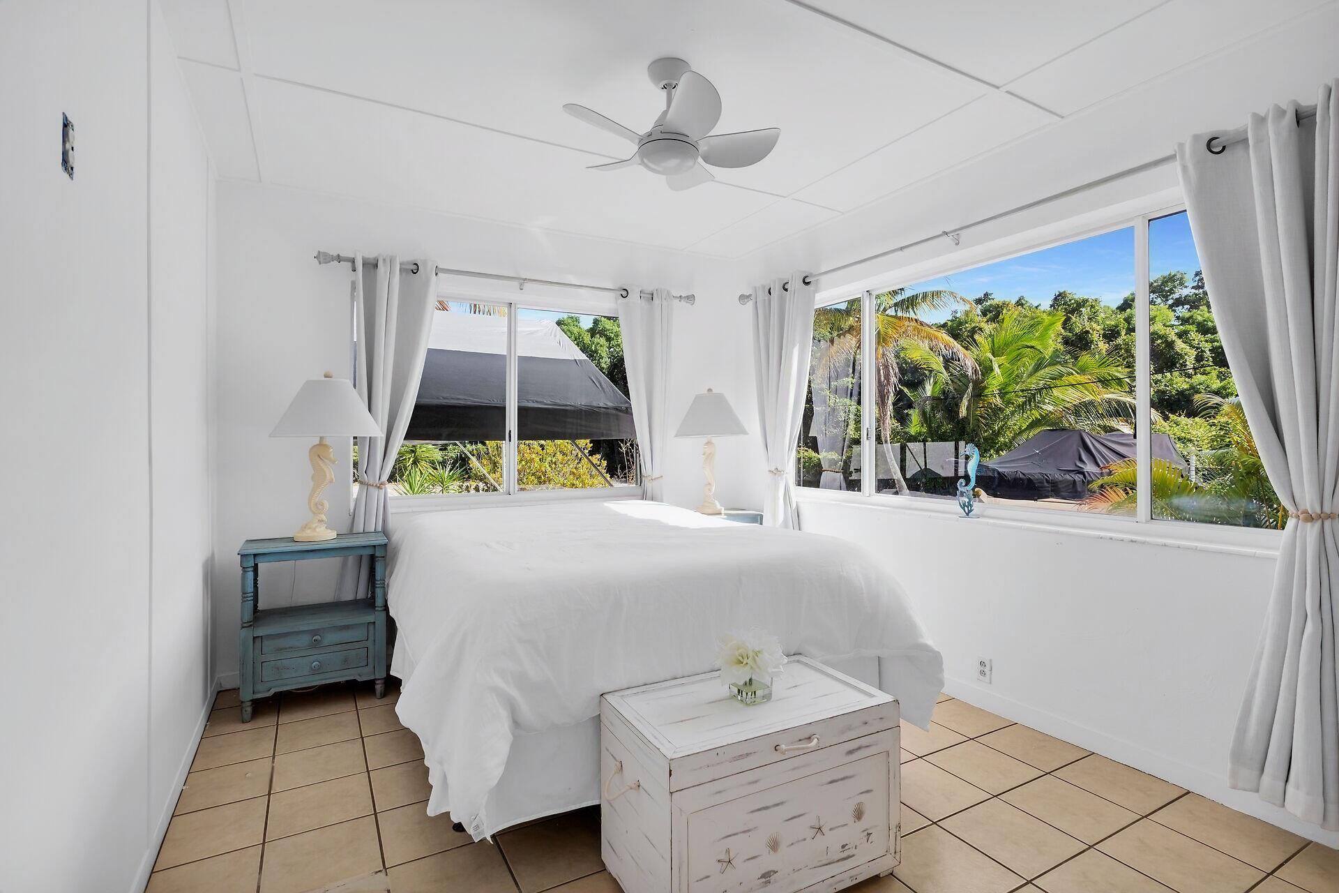 20 Palm Drive Key Largo, FL 33037 - Photo 9 of 47 a bedroom with a bed and a window