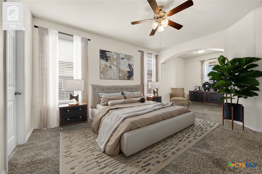 5927 Galveston Road Belton, TX 76513 - Photo 18 of 39 a bedroom with a balcony a bed and a chandelier