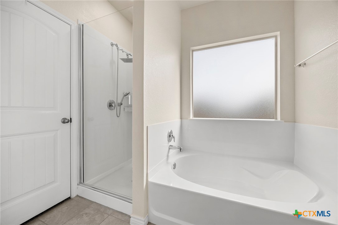 5927 Galveston Road Belton, TX 76513 - Photo 22 of 39 a white bath tub sitting next to a shower