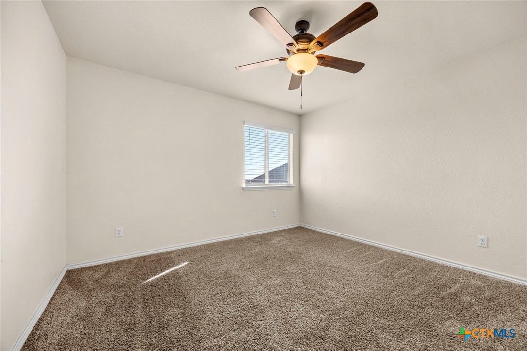 5927 Galveston Road Belton, TX 76513 - Photo 28 of 39 an empty room with a window and a fan