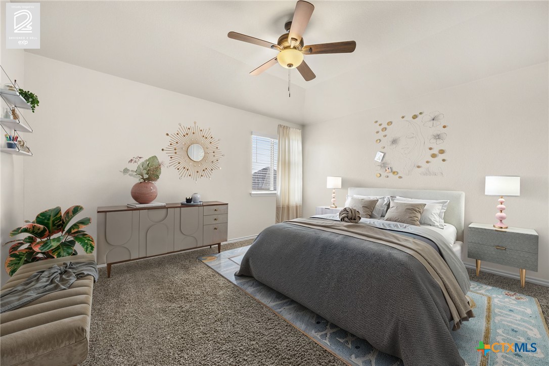 5927 Galveston Road Belton, TX 76513 - Photo 32 of 39 a bedroom with a bed and a chandelier