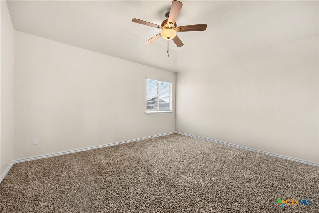 5927 Galveston Road Belton, TX 76513 - Photo 33 of 39 an empty room with a window and a ceiling fan