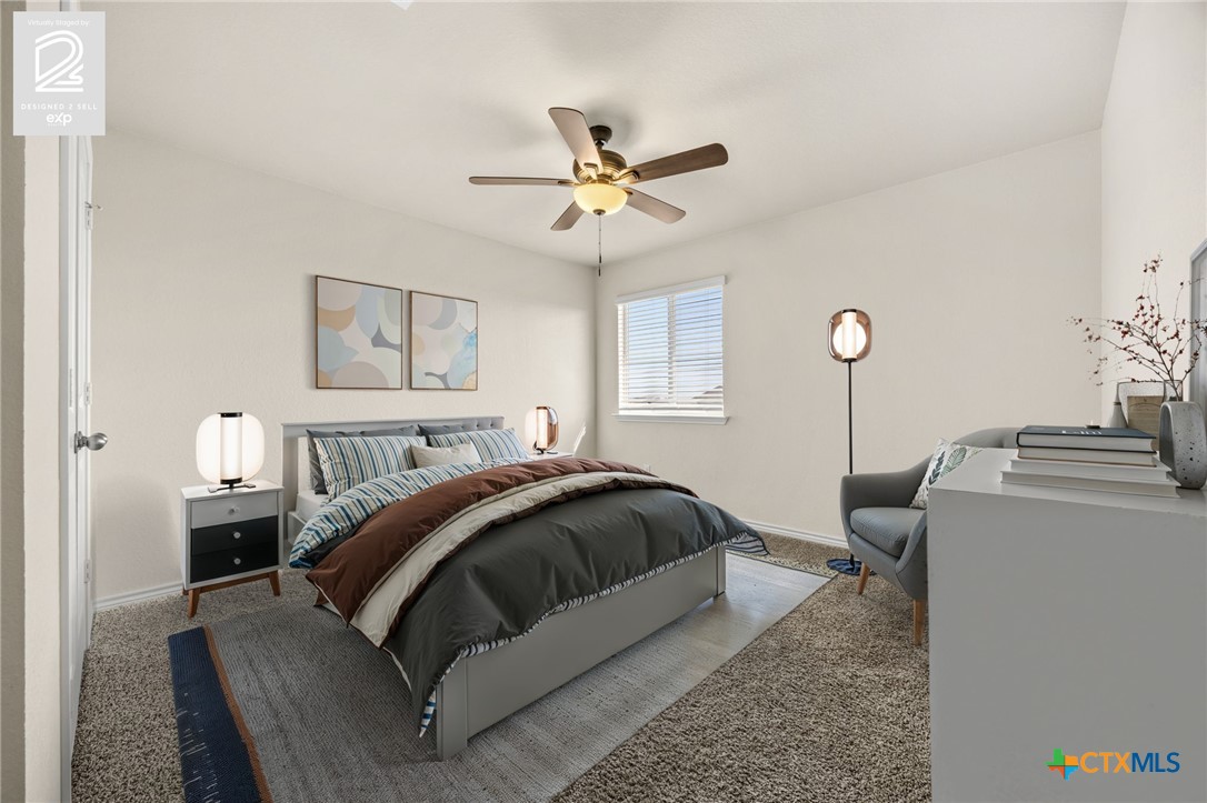 5927 Galveston Road Belton, TX 76513 - Photo 35 of 39 a bedroom with a bed and a chandelier