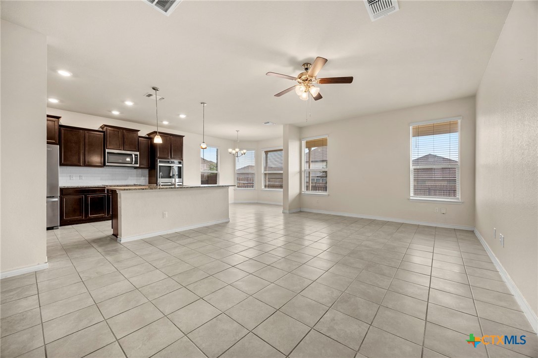 5927 Galveston Road Belton, TX 76513 - Photo 9 of 39 a view of a kitchen with furniture and stainless steel appliances