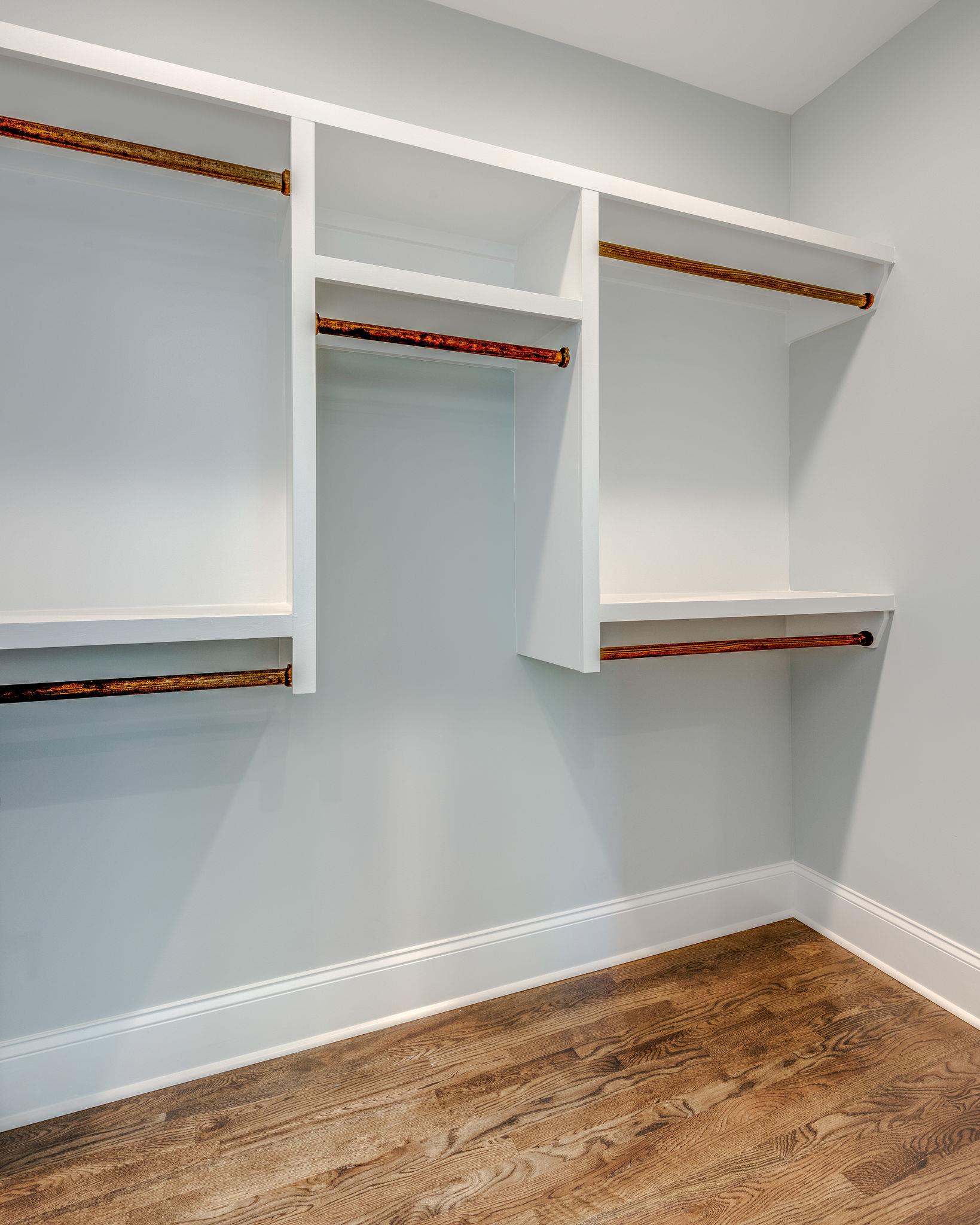 2417 B Porter Road Nashville, TN 37206 - Photo 13 of 21 Master bedroom closet with custom shelving and rods.