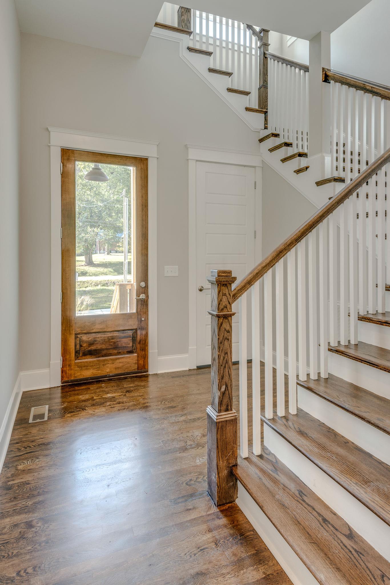 Entry Way  with hardwood floors and coat closet. 