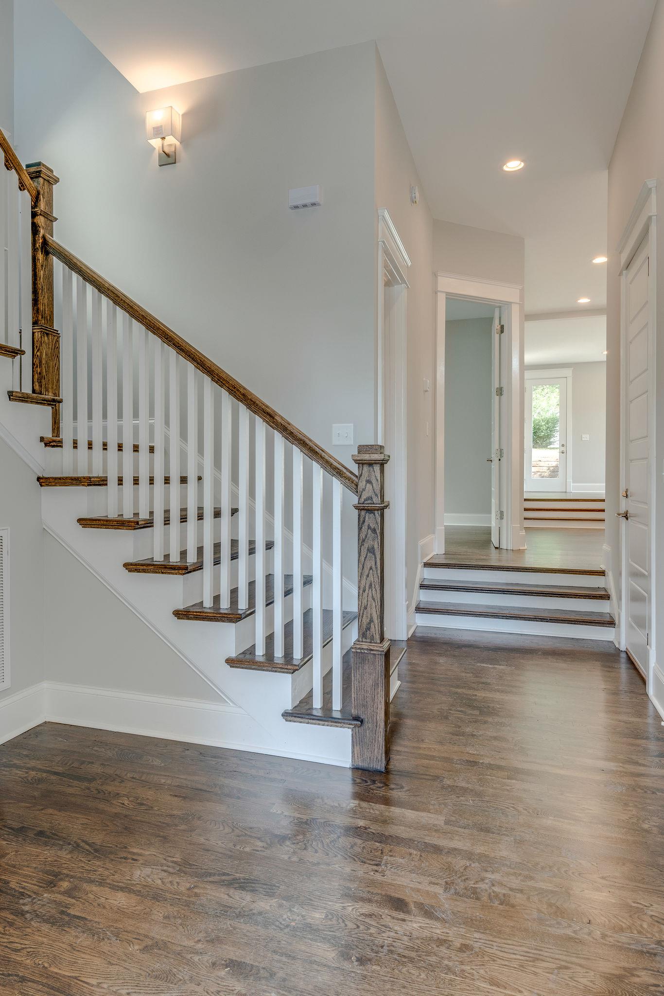 Hardwood stairs leading to second floor or open concept kitchen. 