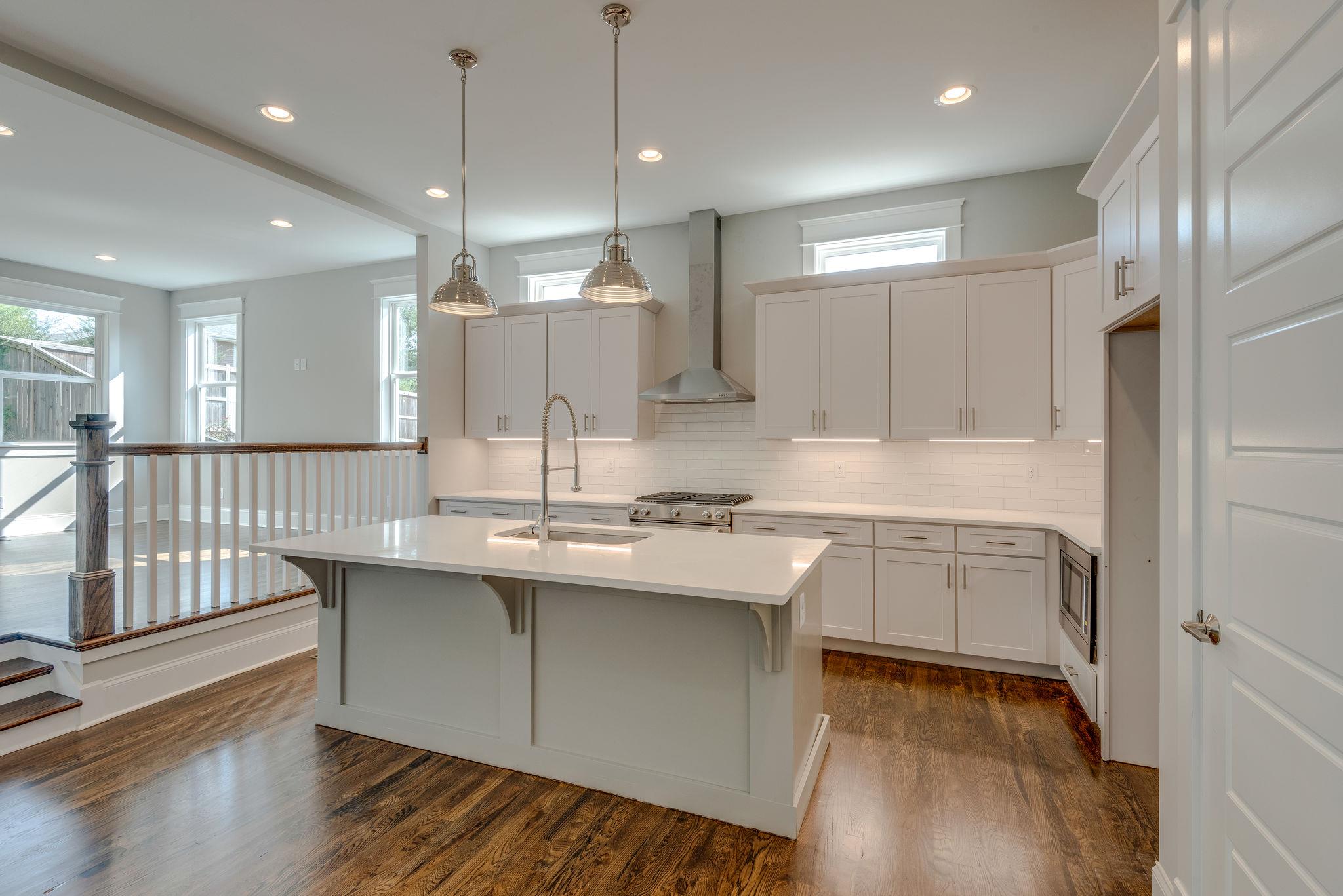 Large kitchen with breakfast bar. 