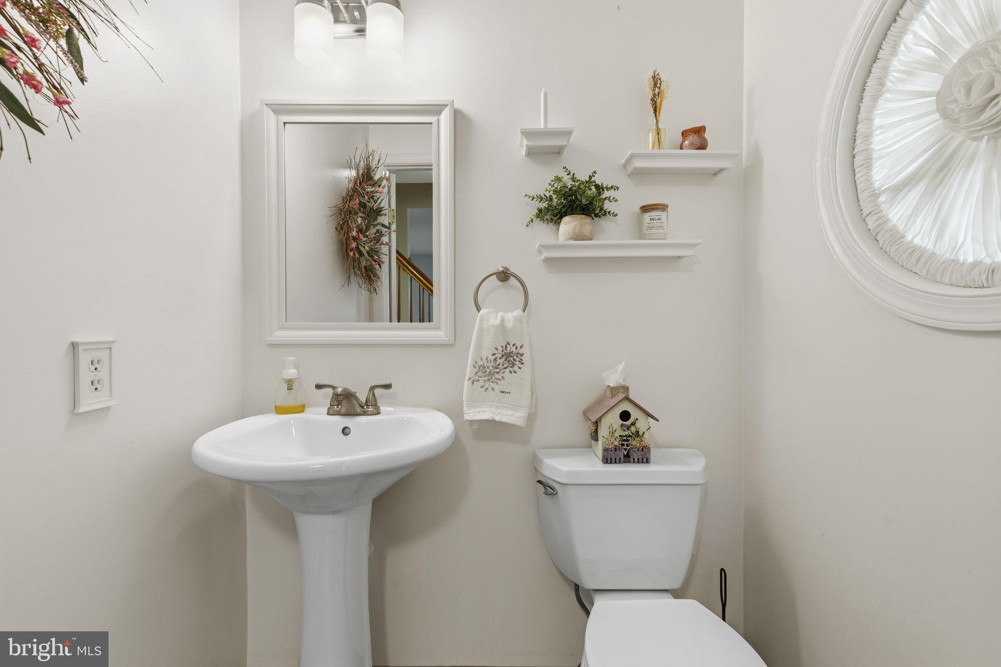 533 Inglewood Road Bel Air, MD 21015 - Photo 18 of 52 a bathroom with a toilet sink and mirror