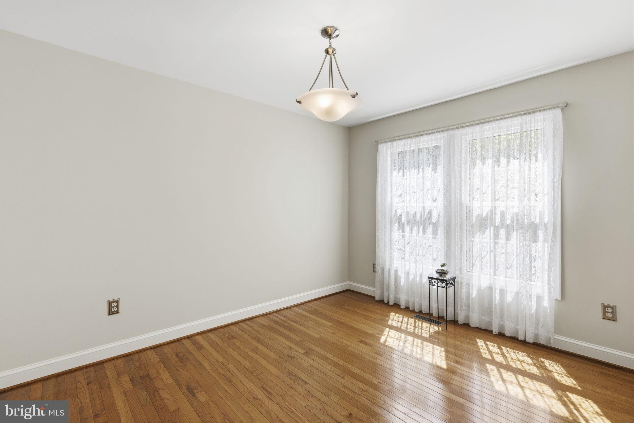 533 Inglewood Road Bel Air, MD 21015 - Photo 9 of 52 an empty room with wooden floor and windows