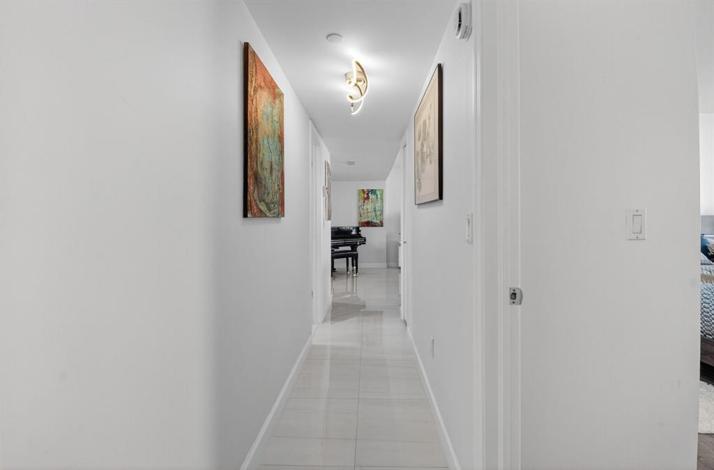 899 Jeffery Street, Unit 710 Boca Raton, FL 33487 - Photo 14 of 44 a view of a hallway with wooden floor