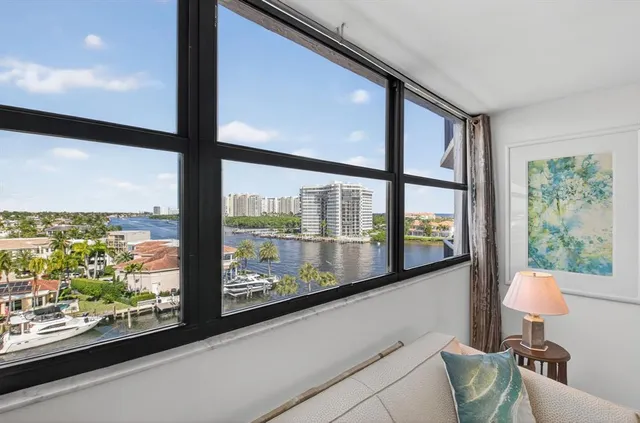 a bathroom with a double vanity sink toilet mirror and shower