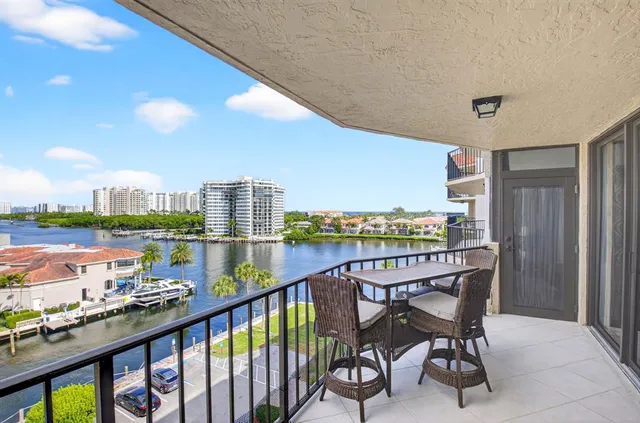 a bedroom with a large bed and a night stand