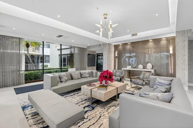 an aerial view of a residential houses with yard and green space