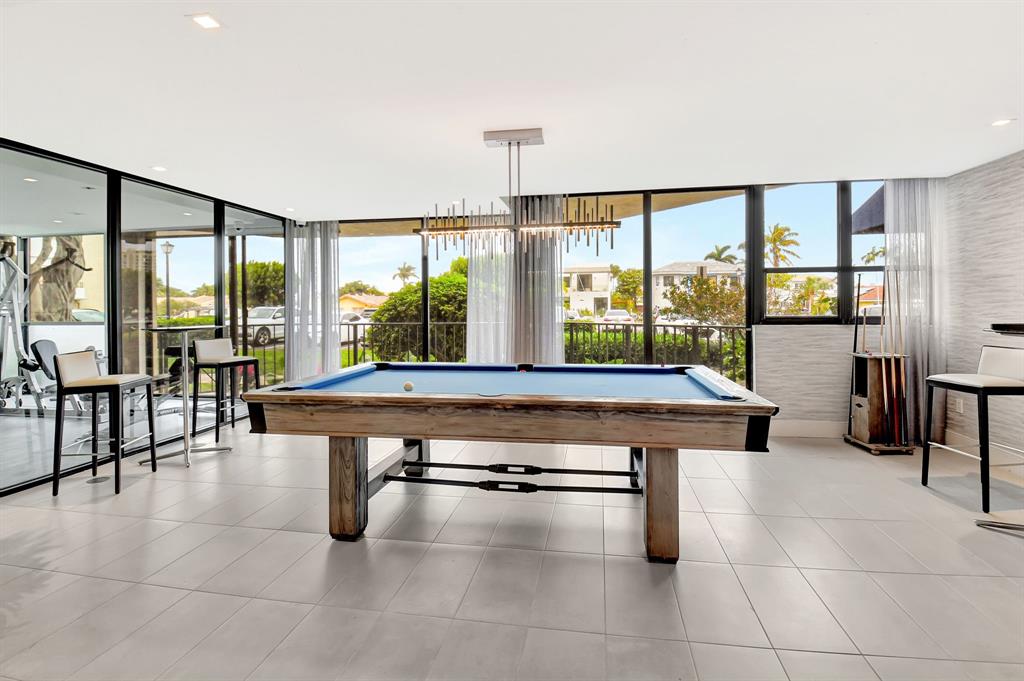 899 Jeffery Street, Unit 710 Boca Raton, FL 33487 - Photo 38 of 44 a room with lots of furniture and windows