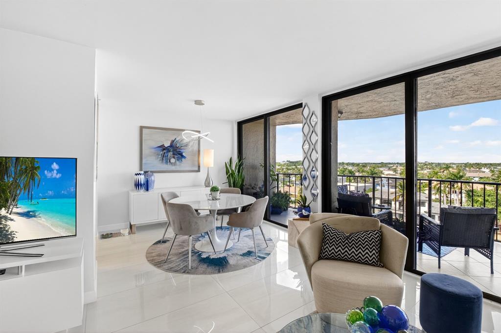 899 Jeffery Street, Unit 710 Boca Raton, FL 33487 - Photo 9 of 44 a living room with furniture large windows and wooden floor