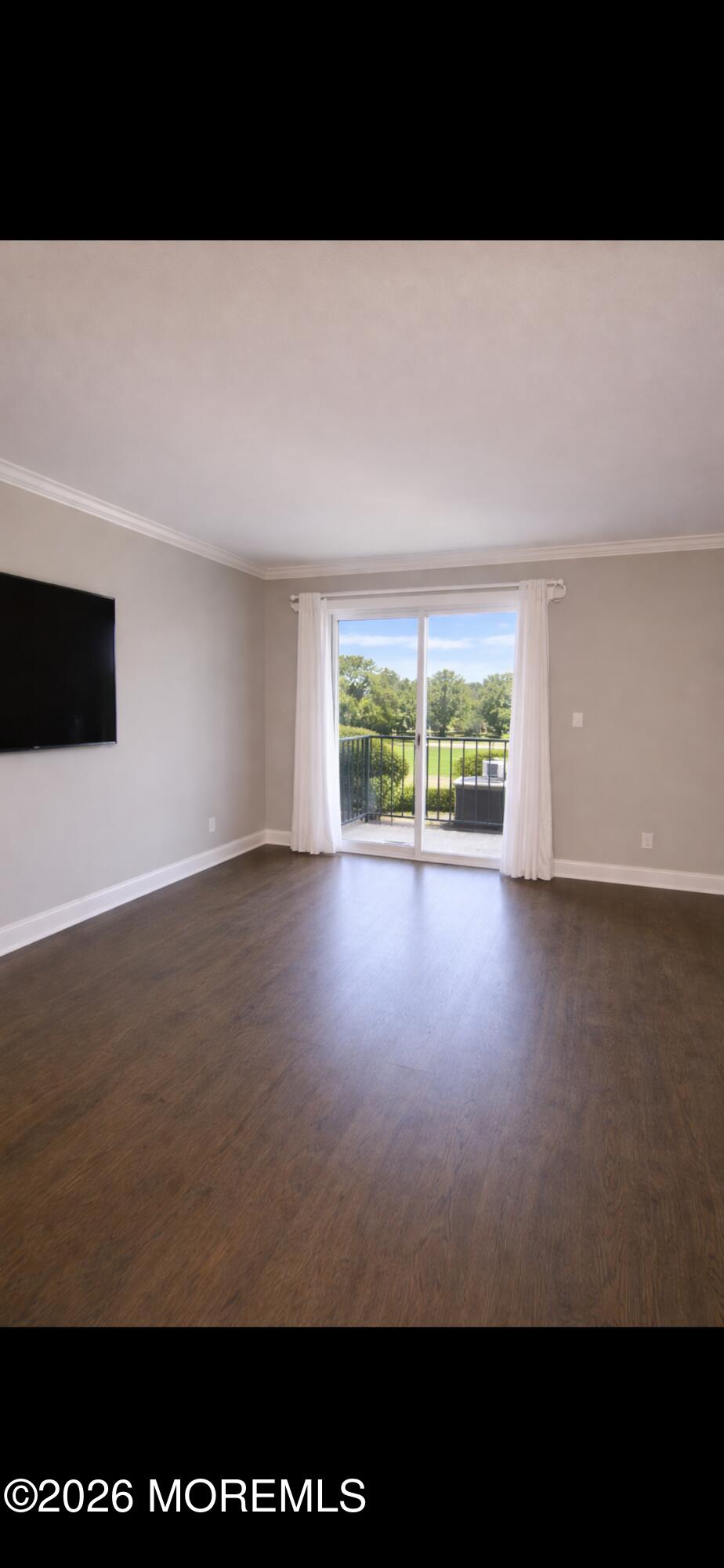 65 Cedar Avenue, Unit B2 Long Branch, NJ 07740 - Photo 7 of 8 a view of an empty room with a window