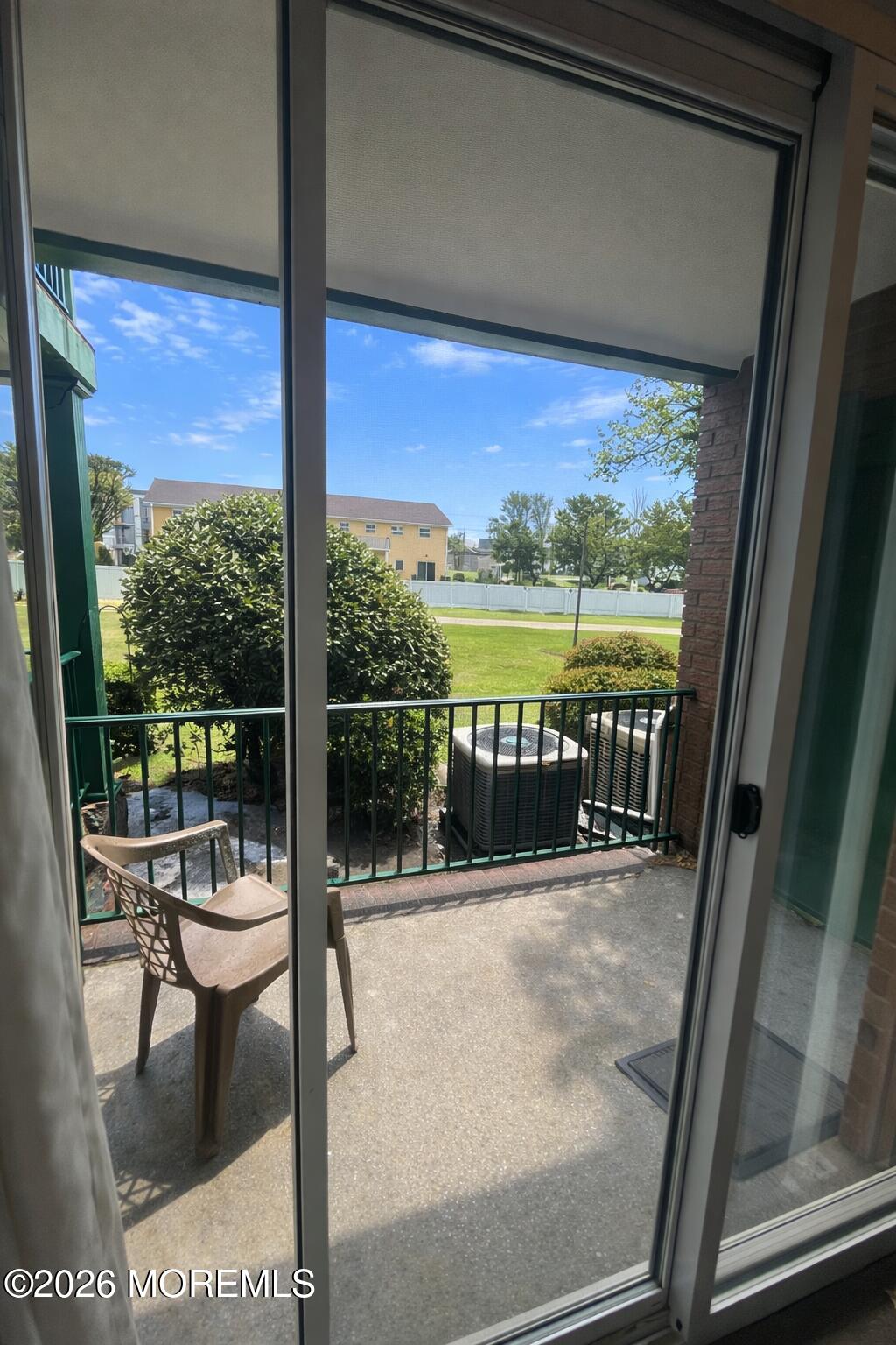 65 Cedar Avenue, Unit B2 Long Branch, NJ 07740 - Photo 8 of 8 a balcony with chairs and ocean view