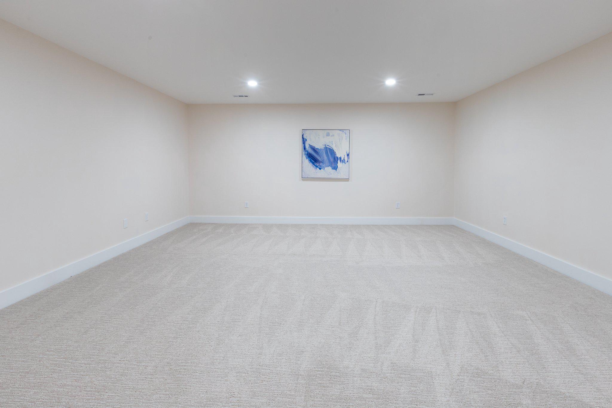 7009 Persimmon Tree Road Bethesda, MD 20817 - Photo 42 of 63 Lower Level - Expansive Media/Exercise Room