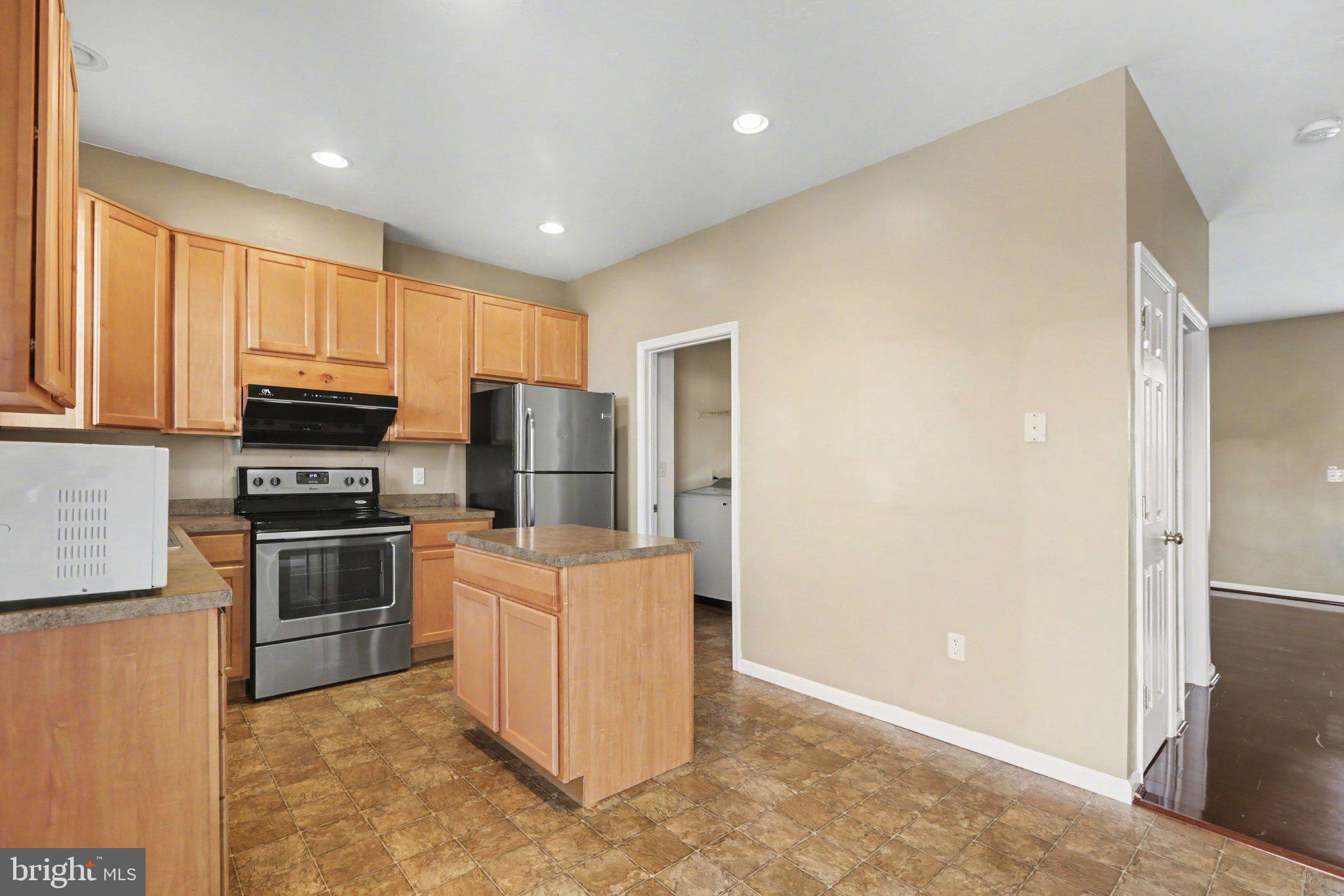 335 Cape Climb York, PA 17408 - Photo 10 of 34 Modern kitchen with warm wood tones.