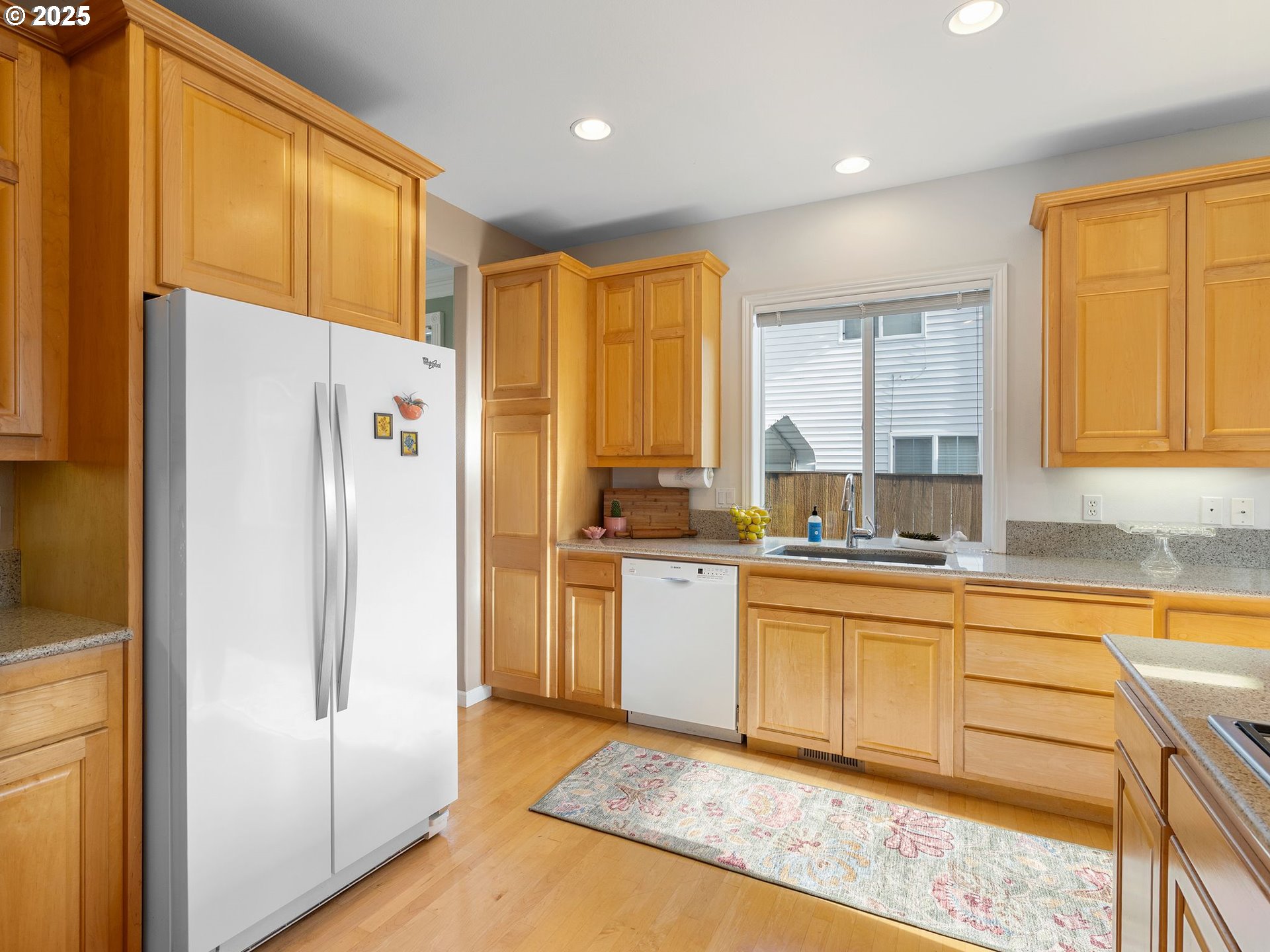3956 Southeast 30th Street Gresham, OR 97080 - Photo 12 of 48 a kitchen with stainless steel appliances granite countertop a refrigerator and a stove top oven