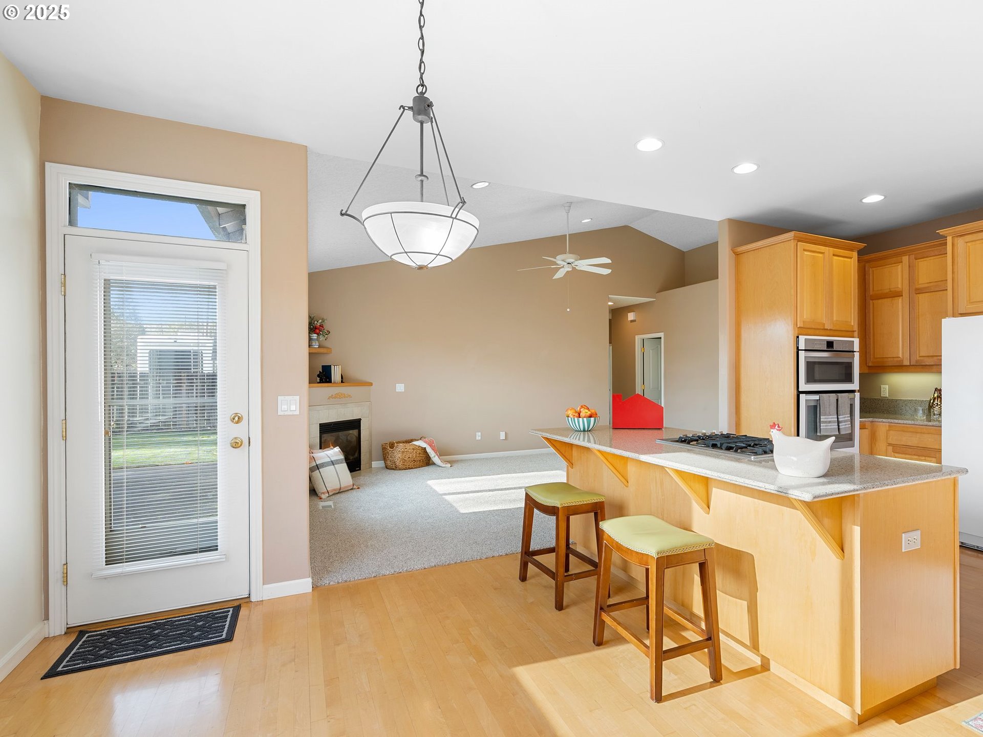 3956 Southeast 30th Street Gresham, OR 97080 - Photo 16 of 48 a room with stainless steel appliances kitchen island granite countertop furniture and a view of living room