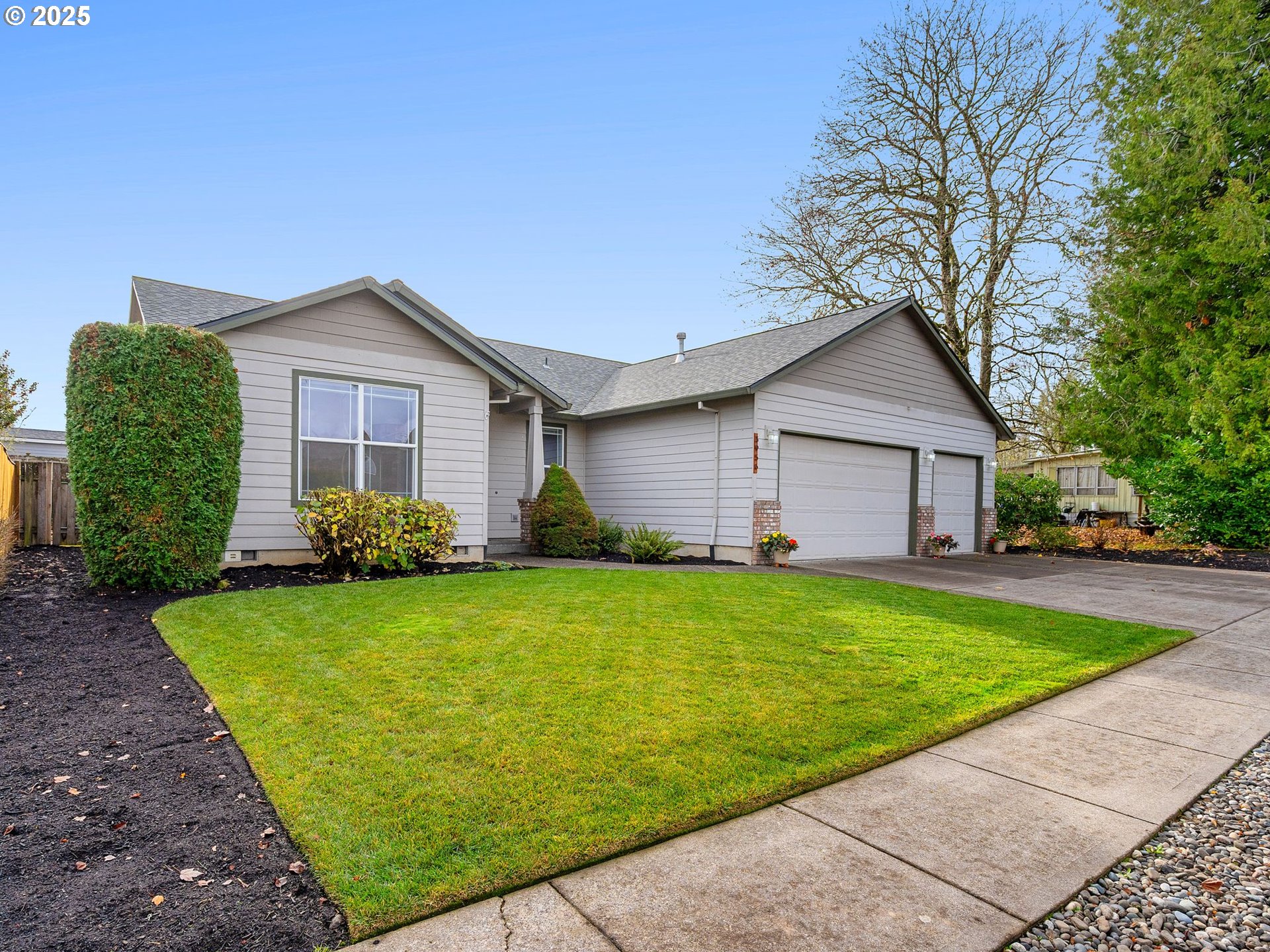 3956 Southeast 30th Street Gresham, OR 97080 - Photo 2 of 48 a front view of a house with garden