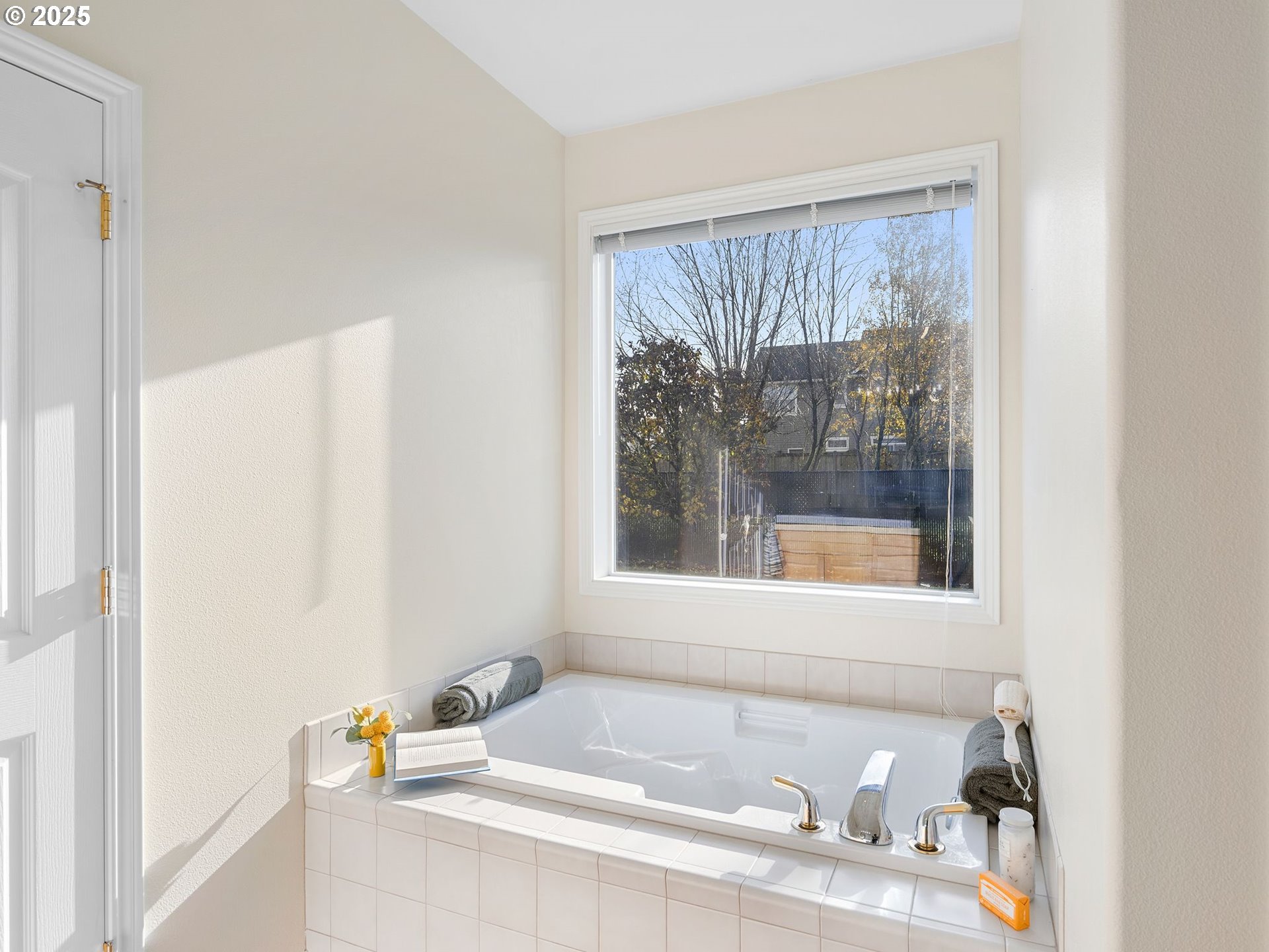 3956 Southeast 30th Street Gresham, OR 97080 - Photo 28 of 48 a bath tub sitting in a bathroom next to a window