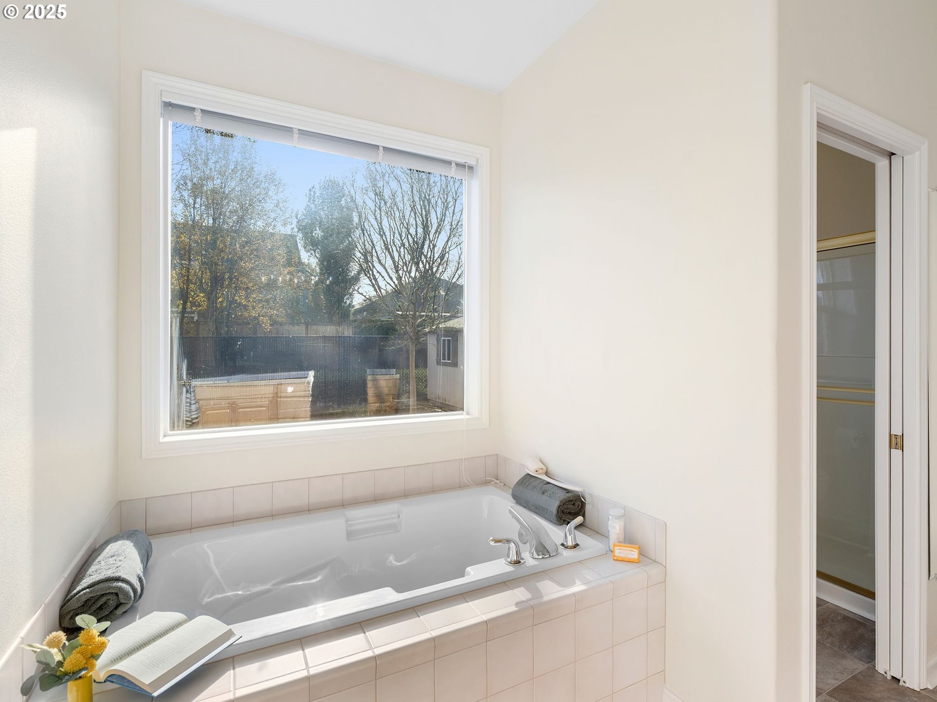 3956 Southeast 30th Street Gresham, OR 97080 - Photo 29 of 48 a bath tub sitting in a bathroom next to a window
