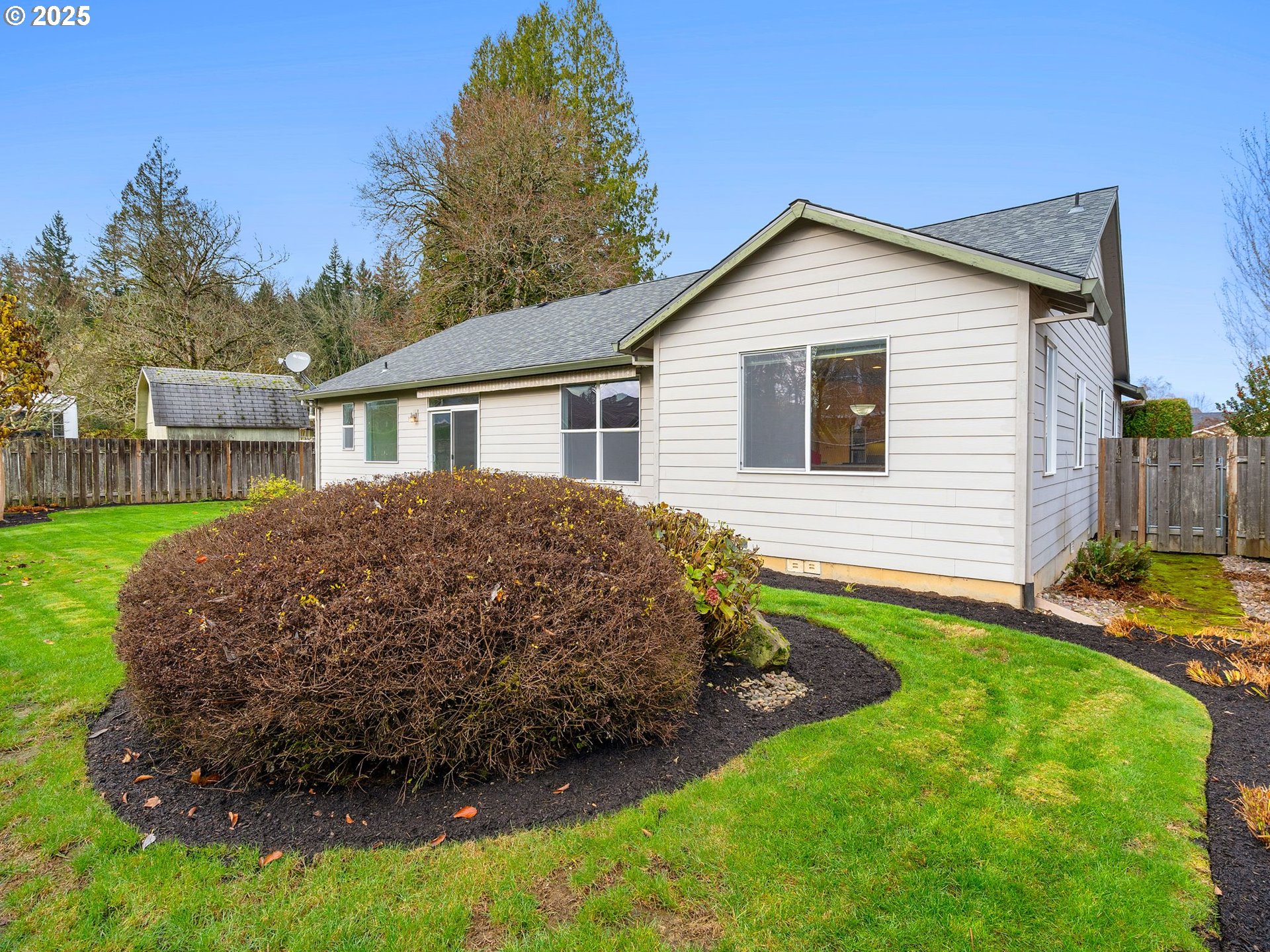 3956 Southeast 30th Street Gresham, OR 97080 - Photo 38 of 48 a view of a house with a yard and sitting area