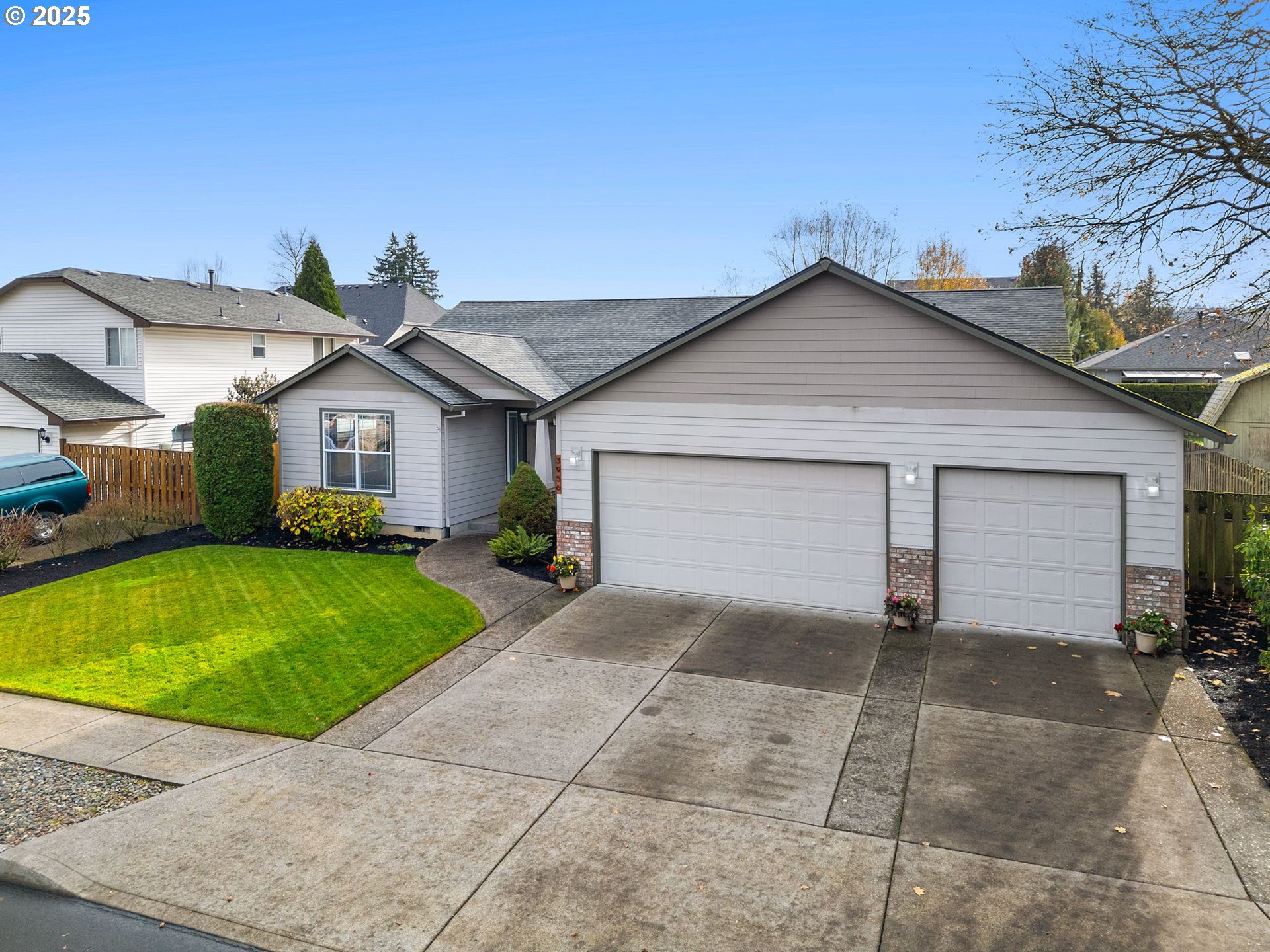 3956 Southeast 30th Street Gresham, OR 97080 - Photo 48 of 48 a front view of a house with a yard and garage