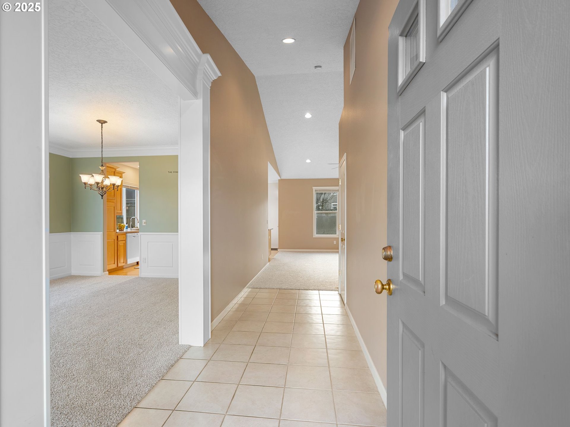 3956 Southeast 30th Street Gresham, OR 97080 - Photo 7 of 48 a view of a hallway with dining area and chandelier