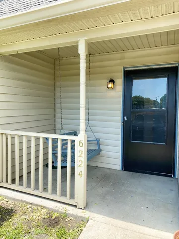 a view of a porch with a door