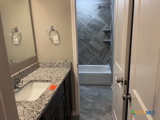 861 Stockdale Road Copperas Cove, TX 76522 - Photo 23 of 35 a bathroom with a granite countertop sink a toilet and bathtub