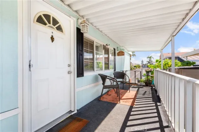 a view of a patio with wooden floor