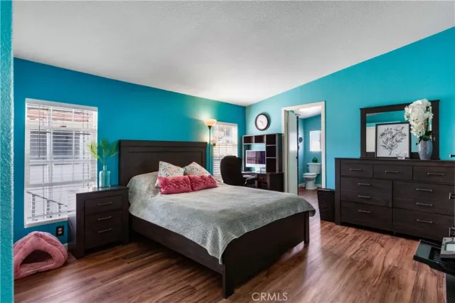 a bedroom with a bed and dresser