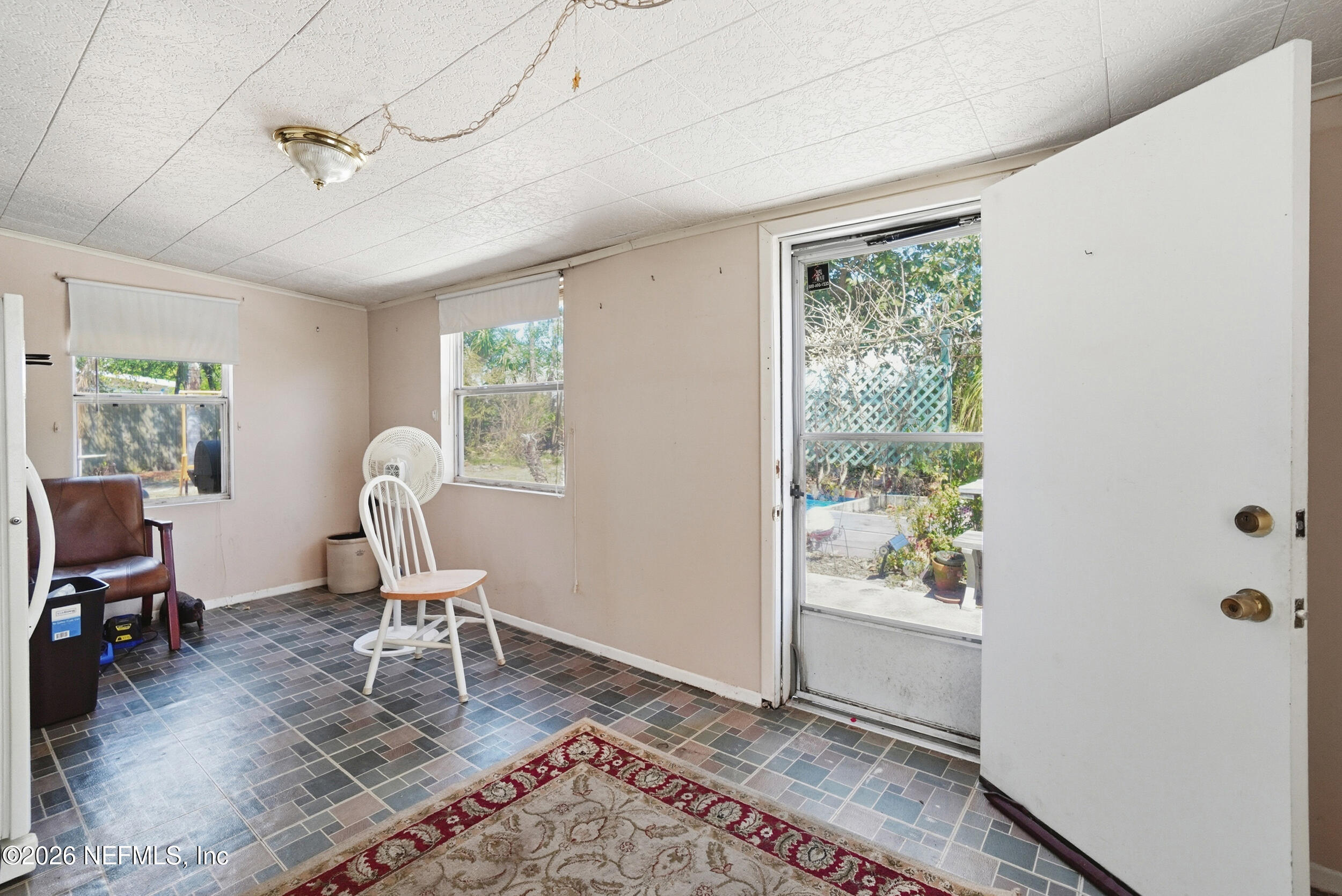 43 Forrestal Circle North Atlantic Beach, FL 32233 - Photo 13 of 39 a view of a workspace with furniture and a window