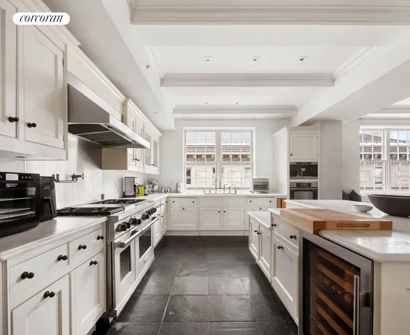 a kitchen with stainless steel appliances a stove sink and cabinets