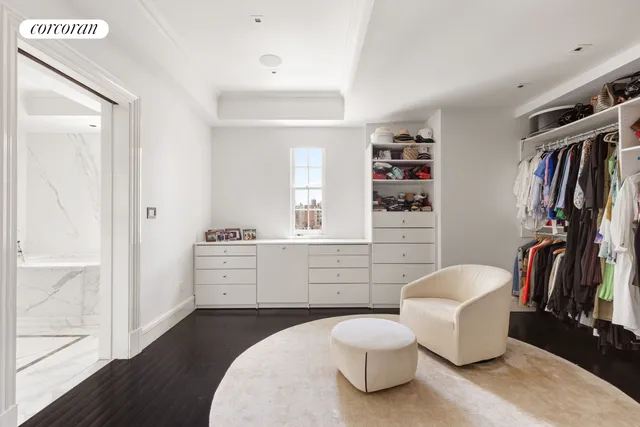 a room with a couch and a bookshelf