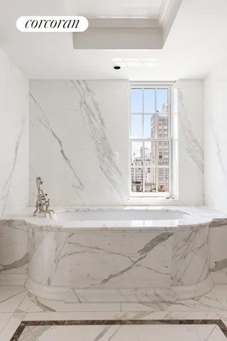 a white bath tub sitting in a room
