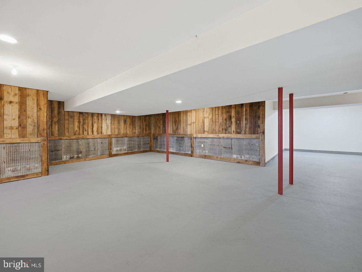 9763 Blue Spring Road Mercersburg, PA 17236 - Photo 55 of 85 an empty room with wooden floor and sliding door
