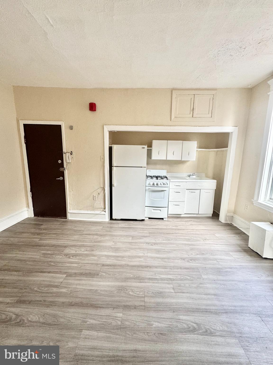 5040 Walnut Street, Unit 3R Philadelphia, PA 19139 - Photo 1 of 9 a view of a room with wooden floor