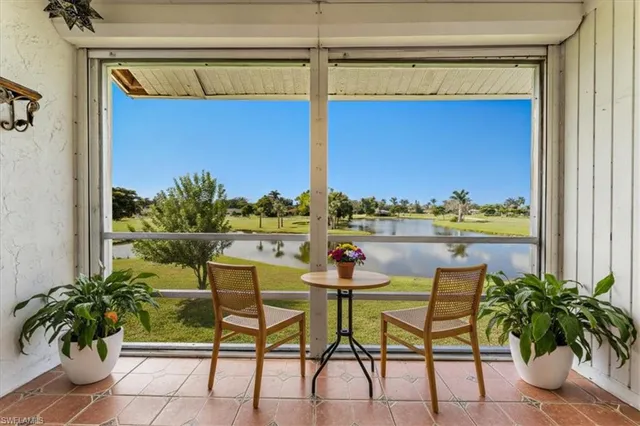 a view of a chairs and table in the balcony