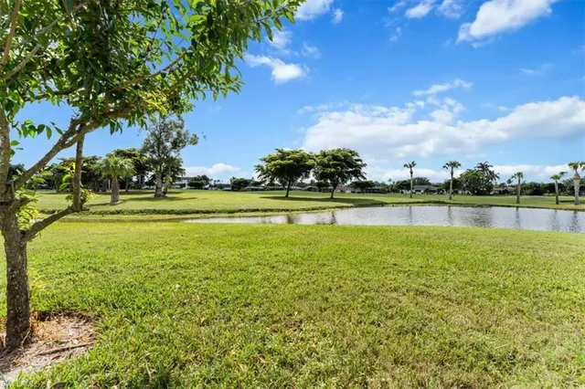a view of a lake with houses in the background