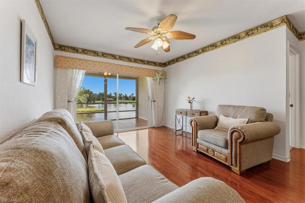 492 Bristle Cone Lane, Unit 47 Naples, FL 34113 - Photo 5 of 21 a living room with furniture and a large window