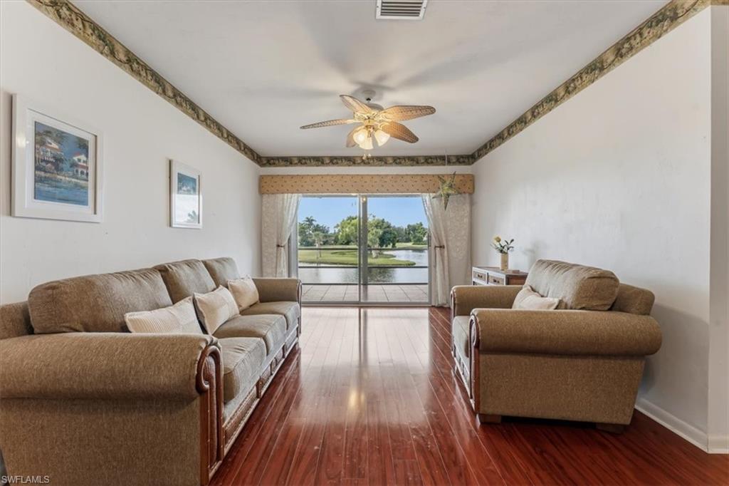492 Bristle Cone Lane, Unit 47 Naples, FL 34113 - Photo 8 of 21 a living room with furniture and a large window