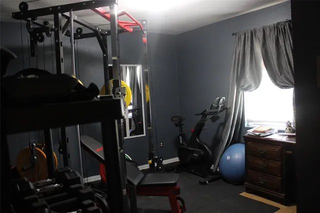 a room with gym equipment and equipment
